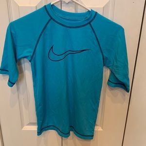 Nike Dri-Fit swim shirt. Kids size M